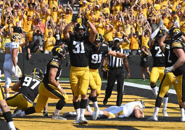 IOWA CITY, IA - SEPTEMBER 18: Iowa linebacker Jack Campbell (31) signals as safety after tackling Kent State quarterback Dustin Crum (7) in the end zone during a college football game between the Kent State Golden Flashes and the Iowa Hawkeyes on September 18, 2021, at Kinnick Stadium,  Iowa City, IA.  (Photo by Keith Gillett/Icon Sportswire via Getty Images),