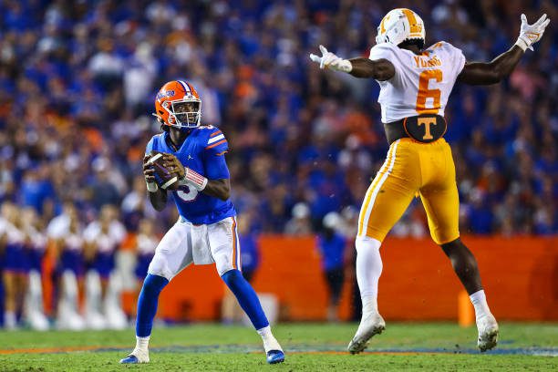 GAINESVILLE, FLORIDA - SEPTEMBER 25: Emory Jones #5 of the Florida Gators looks to pass against Byron Young #6 of the Tennessee Volunteers during the second quarter of a game at Ben Hill Griffin Stadium on September 25, 2021 in Gainesville, Florida. (Photo by James Gilbert/Getty Images)