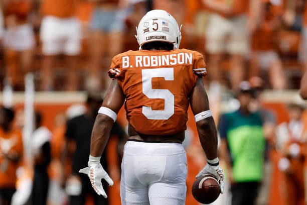 AUSTIN, TEXAS - OCTOBER 15: Bijan Robinson #5 of the Texas Longhorns walks to the sideline in the second half against the Iowa State Cyclones at Darrell K Royal-Texas Memorial Stadium on October 15, 2022 in Austin, Texas. (Photo by Tim Warner/Getty Images)