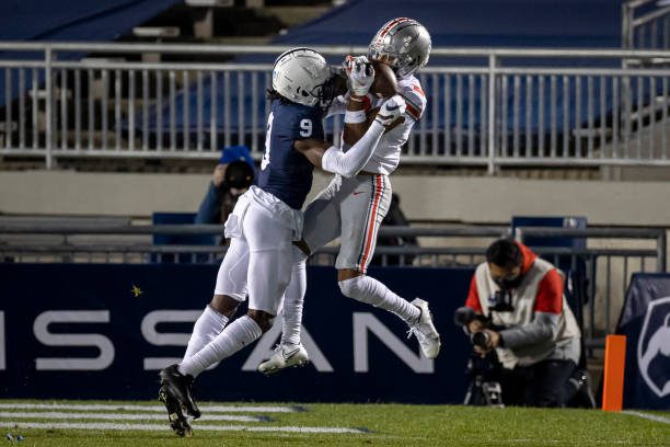 STATE COLLEGE, PA - OCTOBER 31: Chris Olave #2 of the Ohio State Buckeyes catches a pass for a touchdown against Joey Porter Jr. #9 of the Penn State Nittany Lions during the first half at Beaver Stadium on October 31, 2020 in State College, Pennsylvania. (Photo by Scott Taetsch/Getty Images)