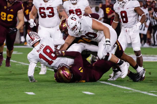 TEMPE, AZ - OCTOBER 08:  Stanford Cardinal quarterback Tanner McKee (18) is sacked by Arizona State Sun Devils defensive lineman Tyler Johnson (41) during the college football game between the Stanford Cardinal and the Arizona State Sun Devils on October 8, 2021 at Sun Devil Stadium in Tempe, Arizona. (Photo by Kevin Abele/Icon Sportswire via Getty Images)
