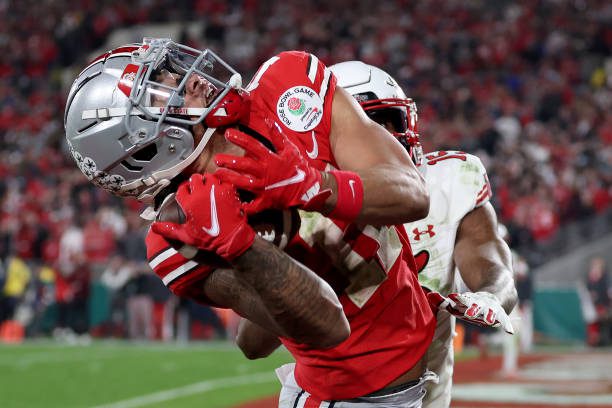 PASADENA, CALIFORNIA - JANUARY 01: Jaxon Smith-Njigba #11 of the Ohio State Buckeyes catches a touchdown pass against the Utah Utes during the fourth quarter in the Rose Bowl Game at Rose Bowl Stadium on January 01, 2022 in Pasadena, California. (Photo by Sean M. Haffey/Getty Images)