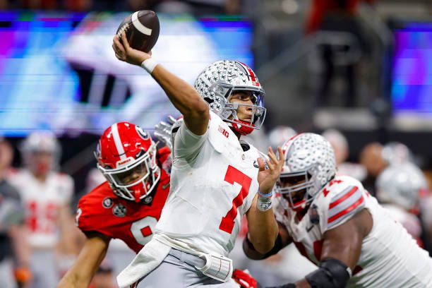 ATLANTA, GA - DECEMBER 31: C.J. Stroud #7 of the Ohio State Buckeyes passes during the second half against the Georgia Bulldogs in the Chick-fil-A Peach Bowl at Mercedes-Benz Stadium on December 31, 2022 in Atlanta, Georgia. (Photo by Todd Kirkland/Getty Images)