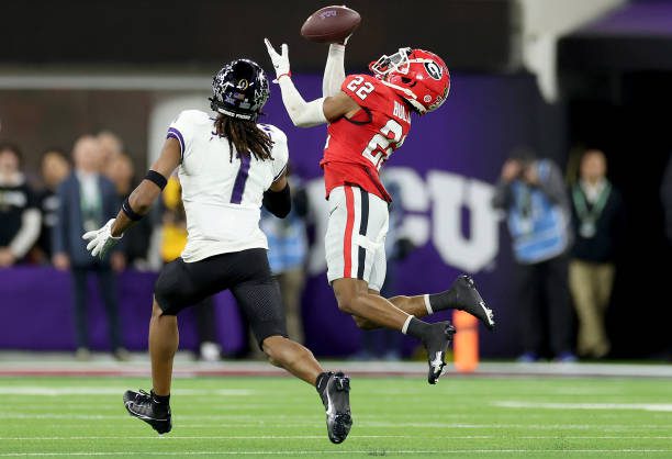 INGLEWOOD, CALIFORNIA - JANUARY 09: Javon Bullard #22 of the Georgia Bulldogs intercepts a pass intended for Quentin Johnston #1 of the TCU Horned Frogs in the second quarter in the College Football Playoff National Championship game at SoFi Stadium on January 09, 2023 in Inglewood, California. (Photo by Ezra Shaw/Getty Images)