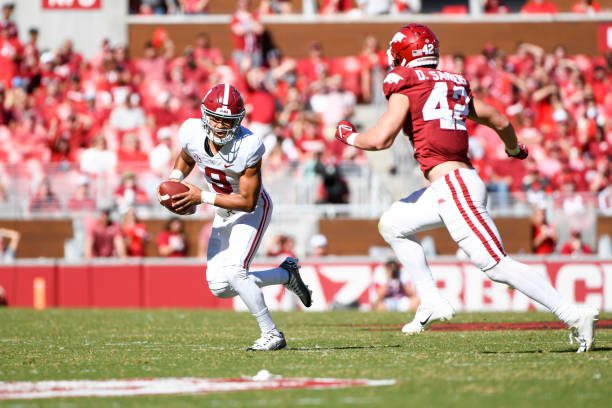 FAYETTEVILLE, AR - OCTOBER 01: Alabama Crimson Tide quarterback Bryce Young (9) is chased down by Arkansas Razorbacks linebacker Drew Sanders (42) during the college football game between the Alabama Crimson Tide and Arkansas Razorbacks on October 1, 2022, at Donald W. Reynolds Razorback Stadium in Fayetteville, Arkansas. (Photo by Andy Altenburger/Icon Sportswire via Getty Images)