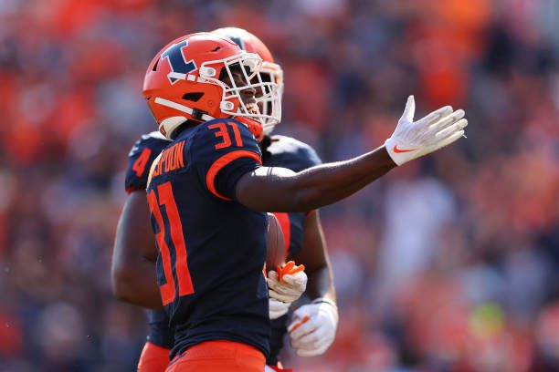 CHAMPAIGN, ILLINOIS - AUGUST 27: Devon Witherspoon #31 of the Illinois Fighting Illini celebrates after intercepting a pass from Andrew Peasley #6 of the Wyoming Cowboys during the first half at Memorial Stadium on August 27, 2022 in Champaign, Illinois. (Photo by Michael Reaves/Getty Images)