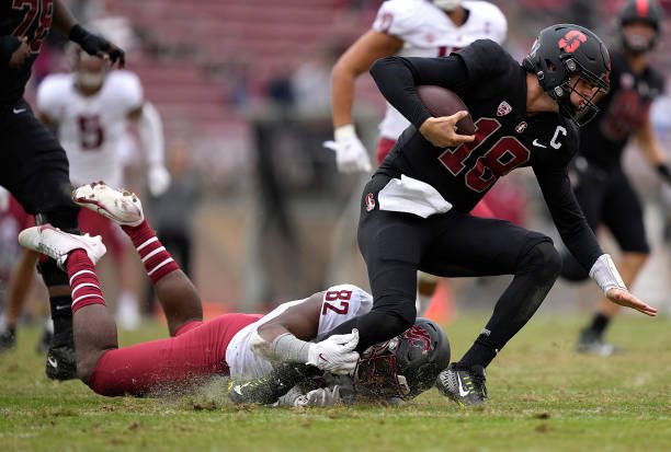 STANFORD, CALIFORNIA - NOVEMBER 05: Travion Brown #82 of the Washington State Cougars sacks quarterback Tanner McKee #18 of the Stanford Cardinal during the third quarter of an NCAA football game at Stanford Stadium on November 05, 2022 in Stanford, California. Washington State won the game 52-14. (Photo by Thearon W. Henderson/Getty Images)