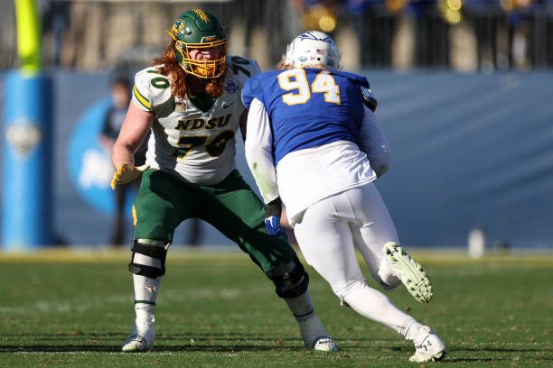 FRISCO, TX - JANUARY 08: Cody Mauch #70 of the North Dakota State Bison blocks against the South Dakota State Jackrabbits in the Division I FCS Football Championship held at Toyota Stadium on January 8, 2023 in Frisco, Texas. (Photo by Justin Tafoya/NCAA Photos via Getty Images)