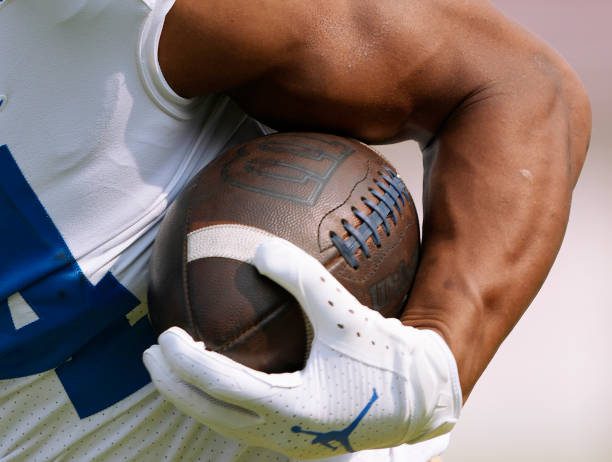 STANFORD, CALIFORNIA - SEPTEMBER 25: A detailed view of a Wilson NCAA football being carried by Zach Charbonnet #24 of the UCLA Bruins during warm ups prior to the start of the game against the Stanford Cardinal at Stanford Stadium on September 25, 2021 in Stanford, California. (Photo by Thearon W. Henderson/Getty Images)