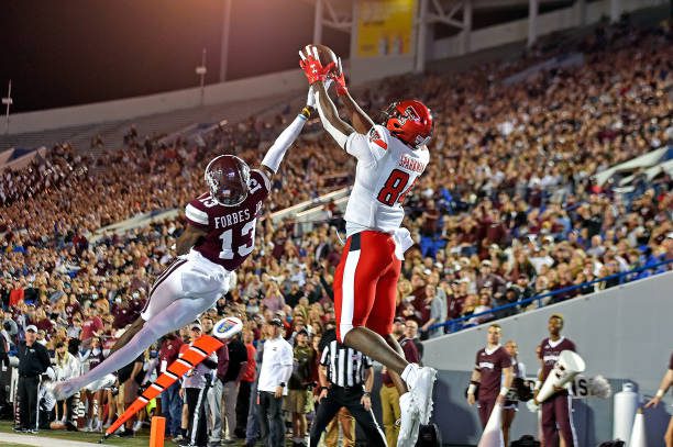 MEMPHIS, TENNESSEE - DECEMBER 28: J.J. Sparkman #84 of the Texas Tech Red Raiders catches a pass for a touchdown against Emmanuel Forbes #13 of the Mississippi State Bulldogs during the second half in the AutoZone Liberty Bowl at Liberty Bowl Memorial Stadium on December 28, 2021 in Memphis, Tennessee. (Photo by Justin Ford/Getty Images)