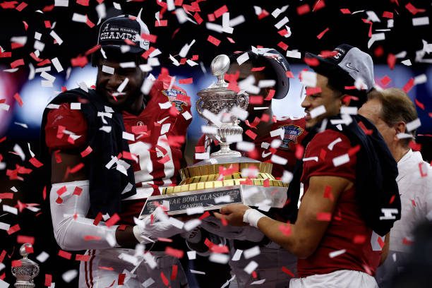 NEW ORLEANS, LOUISIANA - DECEMBER 31: Head coach Nick Saban celebrates with Will Anderson Jr. #31, Jordan Battle #9, and Bryce Young #9 of the Alabama Crimson Tide after defeating the Kansas State Wildcats 45-20 in the Allstate Sugar Bowl at Caesars Superdome on December 31, 2022 in New Orleans, Louisiana. (Photo by Chris Graythen/Getty Images)