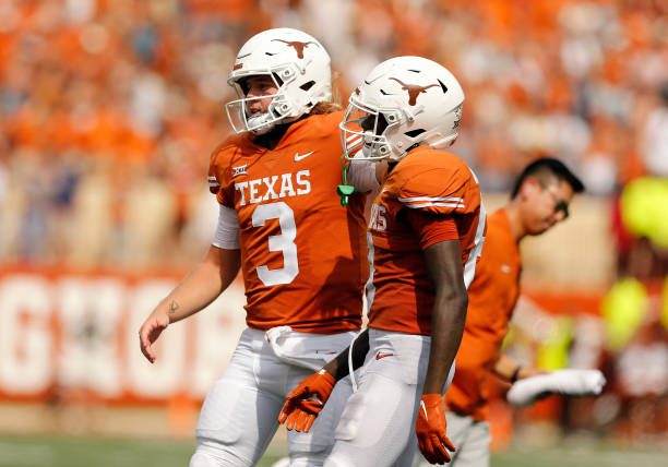 AUSTIN, TX - OCTOBER 15: Texas Longhorns quarterback Quinn Ewers (3) celebrates with Texas Longhorns wide receiver Xavier Worthy (8) after Worthy scores a touchdown against the Iowa State Cyclones during the game on October 15, 2022, at Darrell K Royal - Texas Memorial Stadium in Austin, TX. (Photo by Adam Davis/Icon Sportswire via Getty Images)