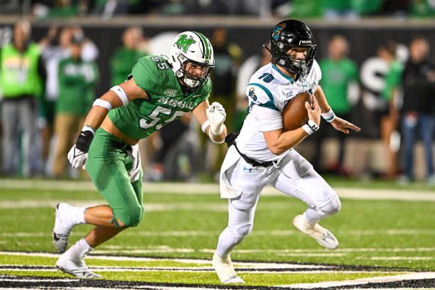 HUNTINGTON, WV - OCTOBER 29, 2022: Grayson McCall #10 of the Coastal Carolina Chanticleers carries the ball during the first half against the Marshall Thundering Herd at Joan C. Edwards Stadium on October 29, 2022 in Huntington, West Virginia. (Photo by Chris Bernacchi/Diamond Images via Getty Images)