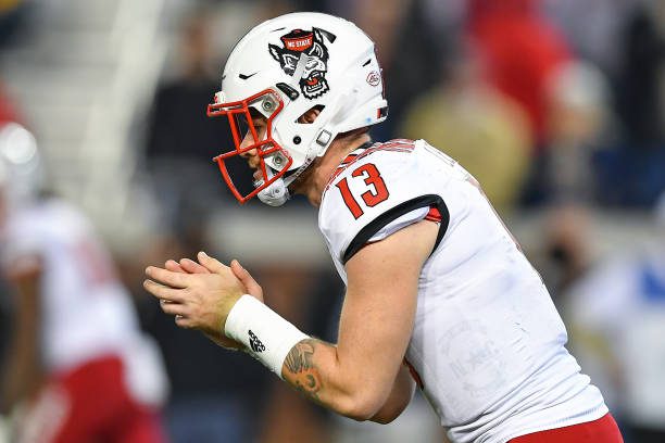 ATLANTA, GA  NOVEMBER 21:  NC State quarterback Devin Leary (13) waits on the snap during the NCAA football game between the North Carolina State Wolfpack and the Georgia Tech Yellow Jackets on November 21st, 2019 at Bobby Dodd Stadium in Atlanta, GA.  (Photo by Rich von Biberstein/Icon Sportswire via Getty Images)