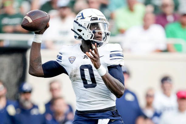 EAST LANSING, MICHIGAN - SEPTEMBER 10: DJ Irons #0 of the Akron Zips throws the ball against the Michigan State Spartans during the first quarter at Spartan Stadium on September 10, 2022 in East Lansing, Michigan. (Photo by Nic Antaya/Getty Images)