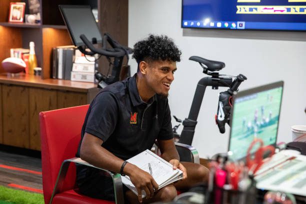 COLLEGE PARK, MARYLAND - Quarterback Taulia Tagovailoa takes notes while going over tape of previous plays at the University of Maryland in College Park, Maryland, on September 13, 2022. (Amanda Andrade-Rhoades/For The Washington Post via Getty Images)