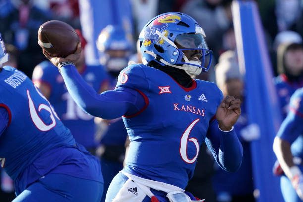 LAWRENCE, KANSAS - NOVEMBER 19: Quarterback Jalon Daniels #6 of the Kansas Jayhawks passes in the first half against the Texas Longhorns at David Booth Kansas Memorial Stadium on November 19, 2022 in Lawrence, Kansas. (Photo by Ed Zurga/Getty Images)