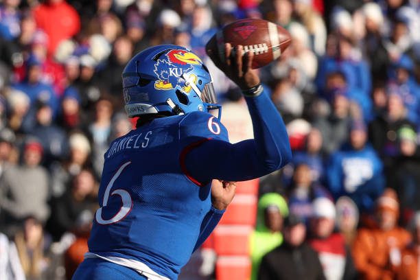 LAWRENCE, KS - NOVEMBER 19: Kansas Jayhawks quarterback Jalon Daniels (6) throws a pass in the first quarter of a Big 12 college football game between the Texas Longhorns and Kansas Jayhawks on November 19, 2022 at Memorial Stadium in Lawrence, KS. (Photo by Scott Winters/Icon Sportswire via Getty Images)