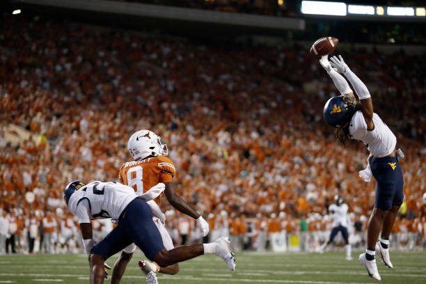AUSTIN, TEXAS - OCTOBER 01: Aubrey Burks #2 of the West Virginia Mountaineers tips a pass intended for Xavier Worthy #8 of the Texas Longhorns in the second half at Darrell K Royal-Texas Memorial Stadium on October 01, 2022 in Austin, Texas. (Photo by Tim Warner/Getty Images)