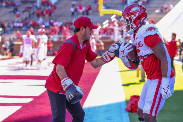 STARKVILLE, MS - OCTOBER 08: An Arkansas assistant tries to punch the ball away for Arkansas Razorbacks running back Raheim Sanders (5) during warm ups before the game between the Mississippi State Bulldogs and the Arkansas Razorbacks on October 8, 2022 at Davis Wade Stadium in Starkville, MS. (Photo by Chris McDill/Icon Sportswire via Getty Images)