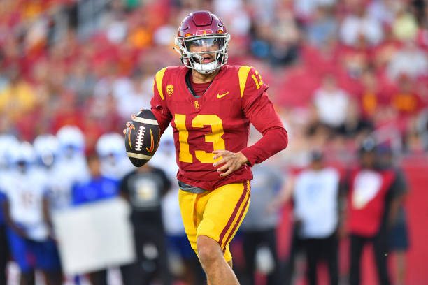 LOS ANGELES, CA - AUGUST 26: USC Trojans quarterback Caleb Williams (13) rolls out to throw a pass during a game between the San Jose State Spartans and the USC Trojans on August 26, 2023, at Los Angeles Memorial Coliseum in Los Angeles, CA. (Photo by Brian Rothmuller/Icon Sportswire via Getty Images)