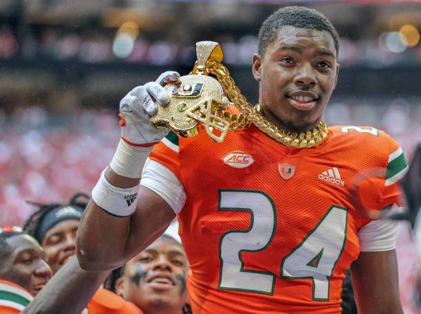 Miami Hurricanes safety Kamren Kinchens (24) got to be the first Miami player to wear the new chain in 2021, only it technically never happened. The safety forced a fumble in the second quarter at Mercedes-Benz Stadium and had the chain placed around his neck to celebrate a turnover that never actually happened during game against the Alabama Crimson Tide in Atlanta on Saturday, Sept. 4, 2021. (Al Diaz/Miami Herald/Tribune News Service via Getty Images)