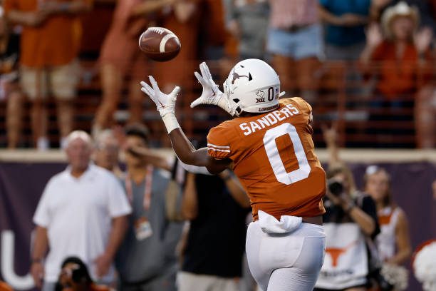 AUSTIN, TEXAS - OCTOBER 01: Ja'Tavion Sanders #0 of the Texas Longhorns catches a touchdown pass in the second quarter against the West Virginia Mountaineers at Darrell K Royal-Texas Memorial Stadium on October 01, 2022 in Austin, Texas. (Photo by Tim Warner/Getty Images)