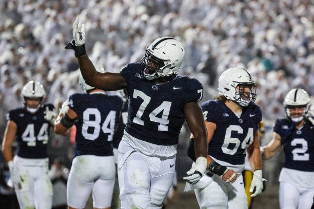STATE COLLEGE, PA - SEPTEMBER 23: Olumuyiwa Fashanu #74 of the Penn State Nittany Lions celebrates after an offensive touchdown during the second half against the Iowa Hawkeyes at Beaver Stadium on September 23, 2023 in State College, Pennsylvania. (Photo by Scott Taetsch/Getty Images)