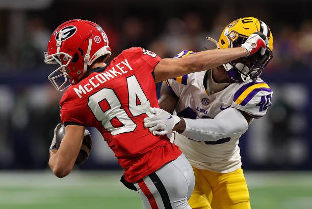 ATLANTA, GEORGIA - DECEMBER 03:  Ladd McConkey #84 of the Georgia Bulldogs against Harold Perkins Jr. #40 ofthe LSU Tigers during the SEC Championship at Mercedes-Benz Stadium on December 03, 2022 in Atlanta, Georgia. (Photo by Kevin C. Cox/Getty Images)
