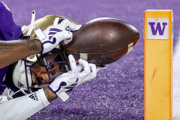 SEATTLE, WASHINGTON - SEPTEMBER 23: Ja'Lynn Polk #2 of the Washington Huskies catches a touchdown pass during the first quarter against the California Golden Bears at Husky Stadium on September 23, 2023 in Seattle, Washington. (Photo by Steph Chambers/Getty Images)