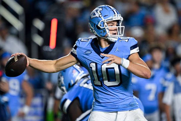 CHAPEL HILL, NORTH CAROLINA - OCTOBER 14: Drake Maye #10 of the North Carolina Tar Heels looks to pass against the Miami Hurricanes during their game at Kenan Memorial Stadium on October 14, 2023 in Chapel Hill, North Carolina. The Tar Heels won 41-31. (Photo by Grant Halverson/Getty Images)