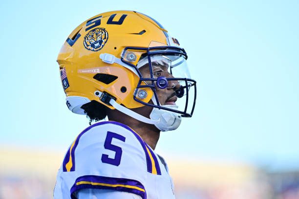 ORLANDO, FLORIDA - SEPTEMBER 03: Jayden Daniels #5 of the LSU Tigers looks on prior to a game against the Florida State Seminoles at Camping World Stadium on September 03, 2023 in Orlando, Florida. (Photo by Julio Aguilar/Getty Images)