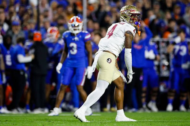 GAINESVILLE, FLORIDA - NOVEMBER 25: Keon Coleman #4 of the Florida State Seminoles looks on during the first half of a game against the Florida Gators at Ben Hill Griffin Stadium on November 25, 2023 in Gainesville, Florida. (Photo by James Gilbert/Getty Images)