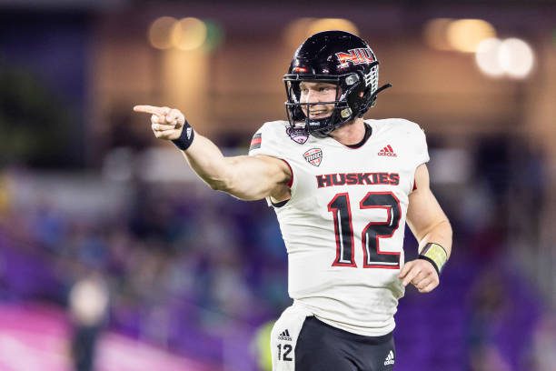 ORLANDO, FLORIDA - DECEMBER 17: Rocky Lombardi #12 of the Northern Illinois Huskies reacts during the first half of the 2021 Cure Bowl against the Coastal Carolina Chanticleers at Exploria Stadium on December 17, 2021 in Orlando, Florida. (Photo by James Gilbert/Getty Images)