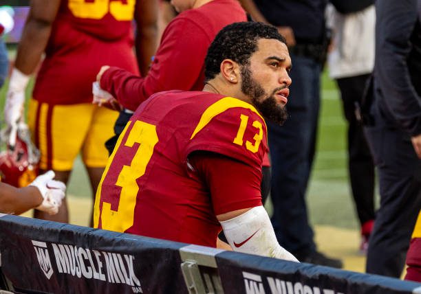 LOS ANGELES, CA  - NOVEMBER 18, 2023:  USC Trojans quarterback Caleb Williams (13) sits on the bench in the final moments of USC's 38-20 loss to UCLA at the LA Memorial Coliseum on November 18, 2023 in Los Angeles, California.(Gina Ferazzi / Los Angeles Times via Getty Images)