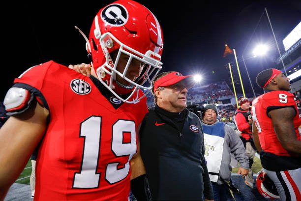 ATLANTA, GEORGIA - NOVEMBER 25: Head coach Kirby Smart leaves the field with Brock Bowers #19 of the Georgia Bulldogs following the 31-23 victory over the Georgia Tech Yellow Jackets at Bobby Dodd Stadium on November 25, 2023 in Atlanta, Georgia. (Photo by Todd Kirkland/Getty Images)