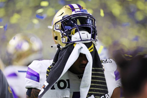 HOUSTON, TEXAS - JANUARY 08: Michael Penix Jr. #9 of the Washington Huskies leaves the field following the 2024 CFP National Championship game against the Michigan Wolverines at NRG Stadium on January 08, 2024 in Houston, Texas.  Michigan defeated Washington 34-13. (Photo by Stacy Revere/Getty Images)