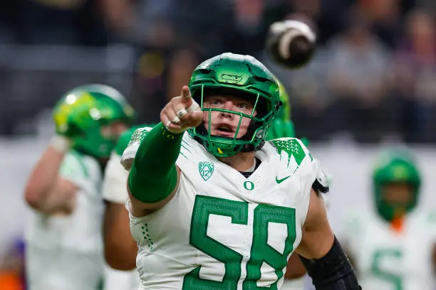 LAS VEGAS, NEVADA - DECEMBER 1: Jackson Powers-Johnson #58 of the Oregon Ducks reacts during the Pac-12 Championship game against the Washington Huskies at Allegiant Stadium on December 1, 2023 in Las Vegas, Nevada. (Photo by Brandon Sloter/Image Of Sport/Getty Images)