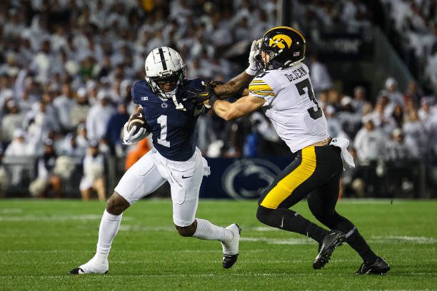 STATE COLLEGE, PA - SEPTEMBER 23: KeAndre Lambert-Smith #1 of the Penn State Nittany Lions carries the ball as Cooper DeJean #3 of the Iowa Hawkeyes defends during the first half at Beaver Stadium on September 23, 2023 in State College, Pennsylvania. (Photo by Scott Taetsch/Getty Images)