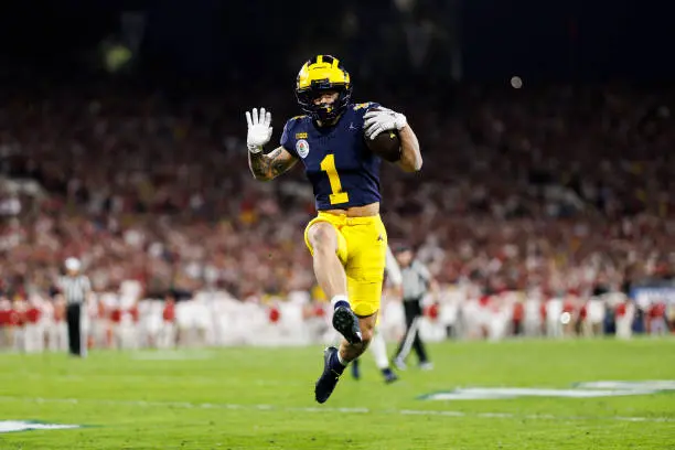 PASADENA, CALIFORNIA - JANUARY 01: Wide receiver Roman Wilson #1 of the Michigan Wolverines celebrates as he scores a touchdown during the CFP Semifinal Rose Bowl Game against the Alabama Crimson Tide at Rose Bowl Stadium on January 1, 2024 in Pasadena, California. (Photo by Ryan Kang/Getty Images)