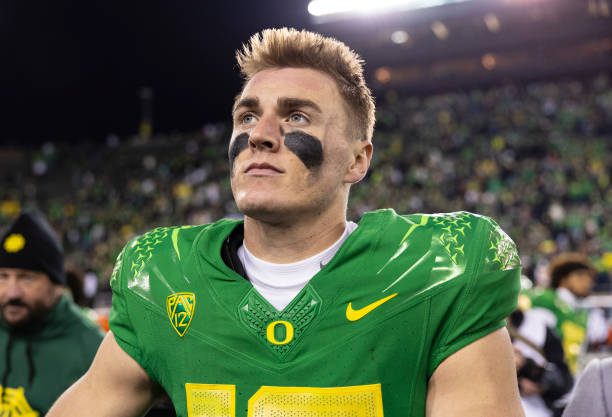 EUGENE, OREGON - NOVEMBER 24: Quarterback Bo Nix #10 of the Oregon Ducks celebrates after defeating the Oregon State Beavers 31-7 at Autzen Stadium on November 24, 2023 in Eugene, Oregon. (Photo by Tom Hauck/Getty Images)