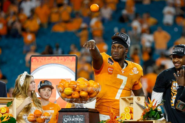 MIAMI GARDENS, FL - DECEMBER 30: Tennessee Volunteers quarterback Joe Milton III (7) tosses an orange to teammates after the Capital One Orange Bowl between the Tennessee Volunteers and the Clemson Tigers on December 30, 2022 at Hard Rock Stadium in Miami Gardens, Fl. (Photo by David Rosenblum/Icon Sportswire via Getty Images)