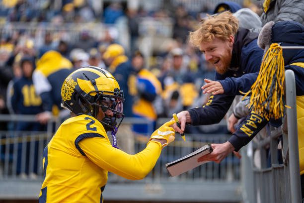 ANN ARBOR, MICHIGAN - APRIL 20: Will Johnson #2 of the Maize Team interacts with fans prior to the Michigan Football Spring Game at Michigan Stadium on April 20, 2024 in Ann Arbor, Michigan. (Photo by Jaime Crawford/Getty Images)