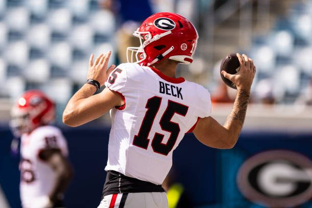 JACKSONVILLE, FLORIDA - OCTOBER 28: Carson Beck #15 of the Georgia Bulldogs warms up before the start of a game against the Florida Gators at EverBank Stadium on October 28, 2023 in Jacksonville, Florida. (Photo by James Gilbert/Getty Images)