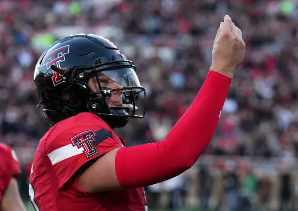 LUBBOCK, TEXAS - NOVEMBER 02: Behren Morton #2 of the Texas Tech Red Raiders celebrates after a touchdown during the first quarter against the TCU Horned Frogs at Jones AT&amp;T Stadium on November 02, 2023 in Lubbock, Texas. (Photo by Josh Hedges/Getty Images)