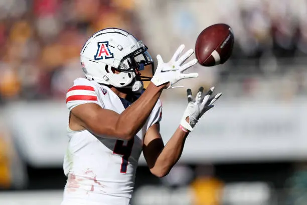 TEMPE, AZ - NOVEMBER 25: Arizona Wildcats wide receiver Tetairoa McMillan #4 catches a pass during the first half of a football game between the ASU Sun Devils and the University of Arizona Wildcats on November 25, 2023 at Mountain America Stadium in Tempe, AZ. (Photo by Christopher Hook/Icon Sportswire via Getty Images)