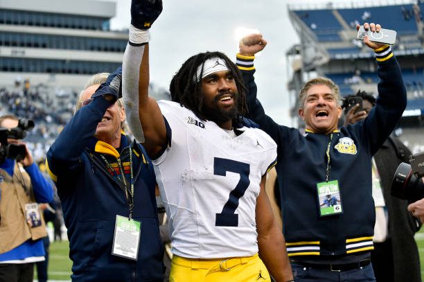 UNIVERSITY PARK, PA - NOVEMBER 11: Michigan running back Donovan Edwards (7) celebrates as he leaves the field after the Michigan Wolverines versus Penn State Nittany Lions game on November 11, 2023 at Beaver Stadium in University Park, PA. (Photo by Randy Litzinger/Icon Sportswire via Getty Images)