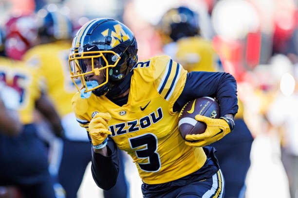 FAYETTEVILLE, ARKANSAS - NOVEMBER 24: Luther Burden III #3 of the Missouri Tigers runs the ball during the game against the Arkansas Razorbacks at Donald W. Reynolds Razorback Stadium on November 24, 2023 in Fayetteville, Arkansas.  The Tigers defeated the Razorbacks 48-14.  (Photo by Wesley Hitt/Getty Images)