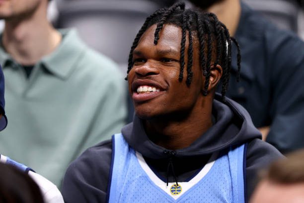 DENVER, COLORADO - DECEMBER 25: Travis Hunter of the Colorado Buffaloes football team watches the action between the Denver Nuggets and the Golden State Warriors at Ball Arena on December 25, 2023 in Denver, Colorado. NOTE TO USER: User expressly acknowledges and agrees that, by downloading and/or using this Photograph, user is consenting to the terms and conditions of the Getty Images License Agreement. (Photo by Jamie Schwaberow/Getty Images)