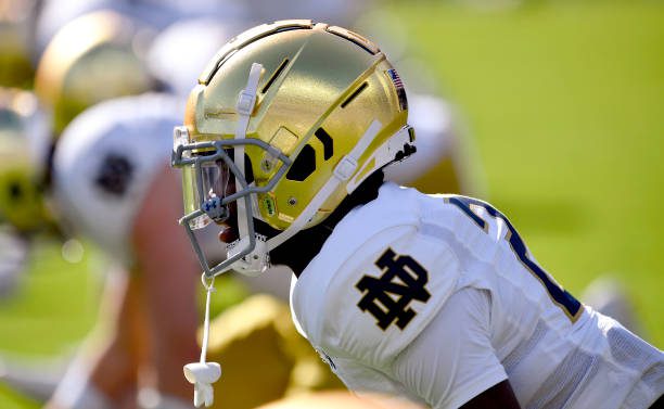 BALTIMORE, MD - NOVEMBER 12: A close up side view of a Notre Dame golden / gold Schutt football helmet shining in the afternoon sunlight on Notre Dame cornerback Benjamin Morrison (20) during the Notre Dame Fighting Irish versus Navy Midshipmen game on November 12, 2022 at M&amp;T Bank Stadium in Baltimore, MD. (Photo by Randy Litzinger/Icon Sportswire via Getty Images)